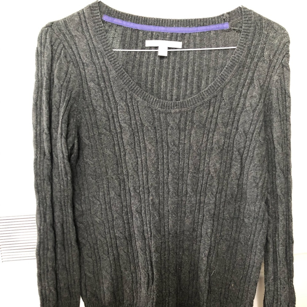 Woman’s grey sweater